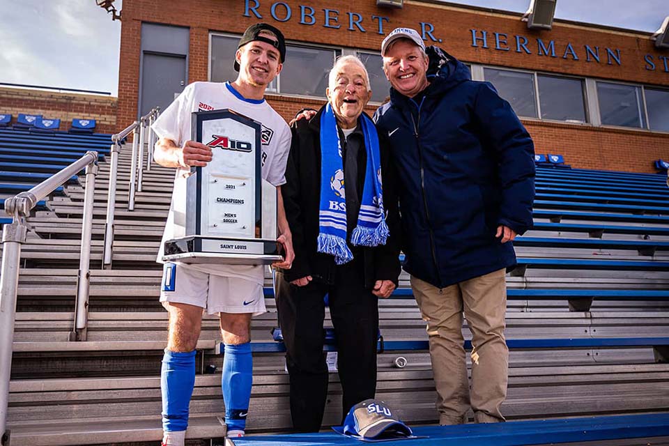 Three generations of the Klein family pose for a photo at Hermann Stadium on campus.