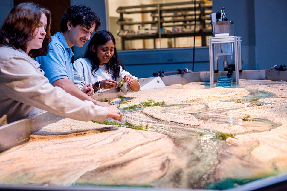 Students work with the Water and Sediment Flume in the WATER Institute 