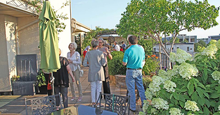 Attendees standing outside the venue's front door