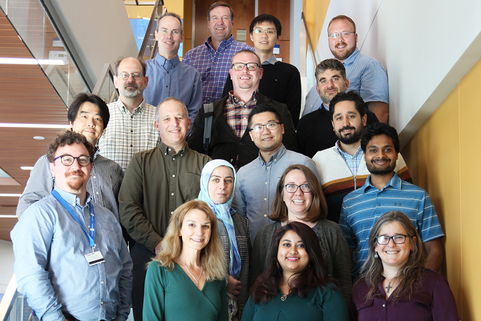 Computer Science Faculty posed on stairs of the ISE Building.